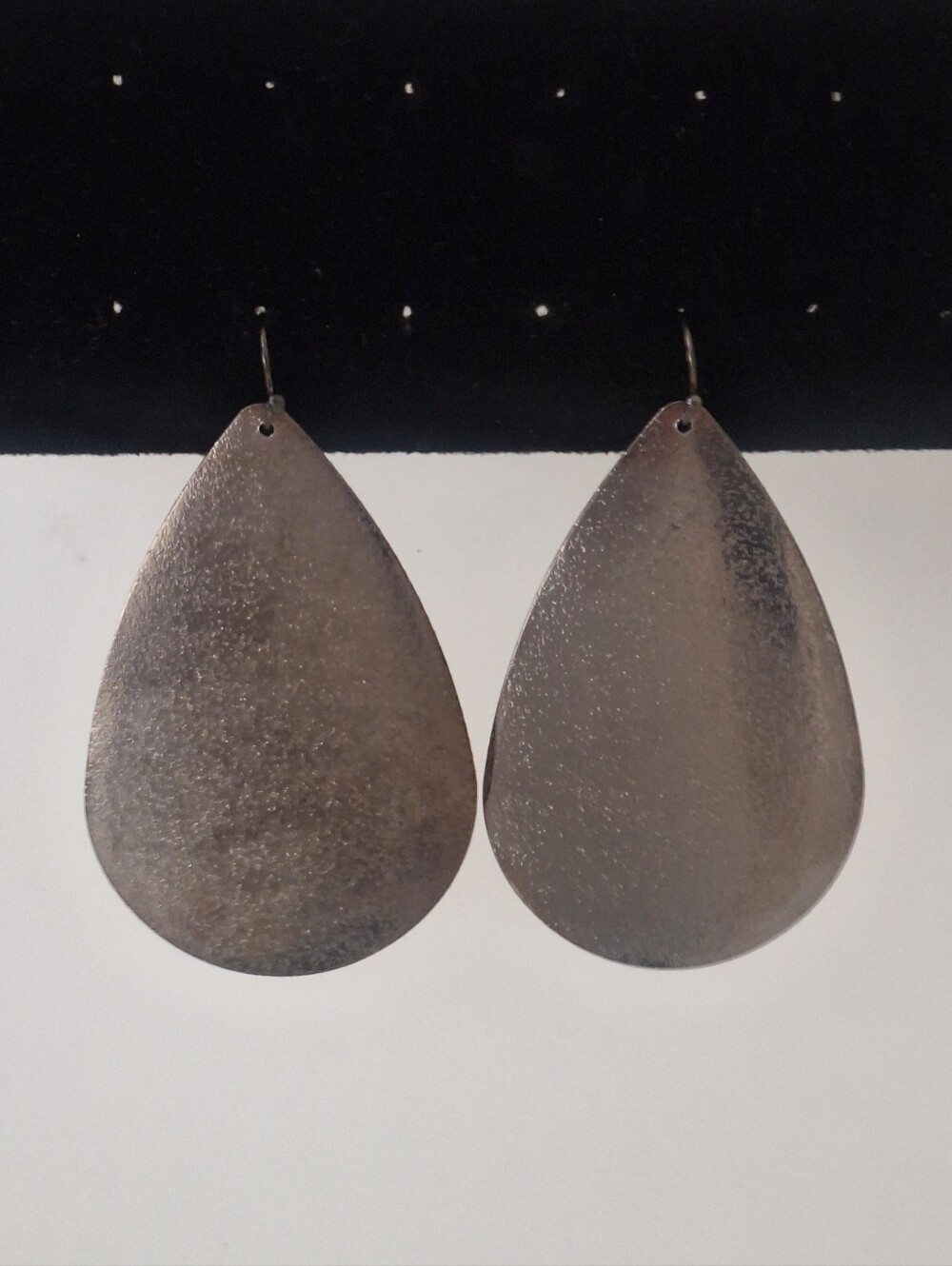 Silver tone flat teardrop earrings